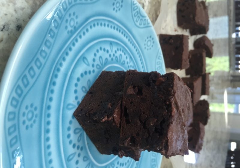 Lentil Walnut Brownies on a round blue plate. Ingredients include canned lentils, cocoa, eggs, flour, chocolate chips, walnuts.