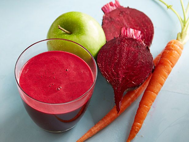A photo of beet juice in a glass. Ingredients include beet, apple, carrot.
