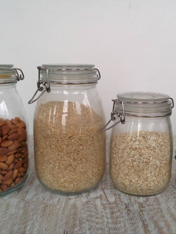 A photo of pantry items in storage jars.
