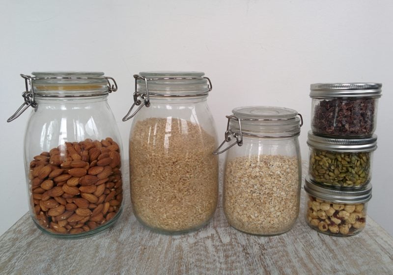 A photo of pantry items in storage jars.