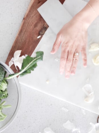 Lindsay Pleskot preparing food in the kitchen. Time Saving Kitchen Tools blog post.