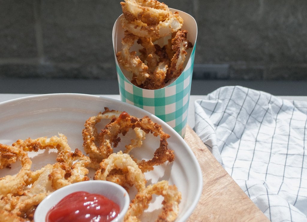 Homemade onion rings with ketchup. 
