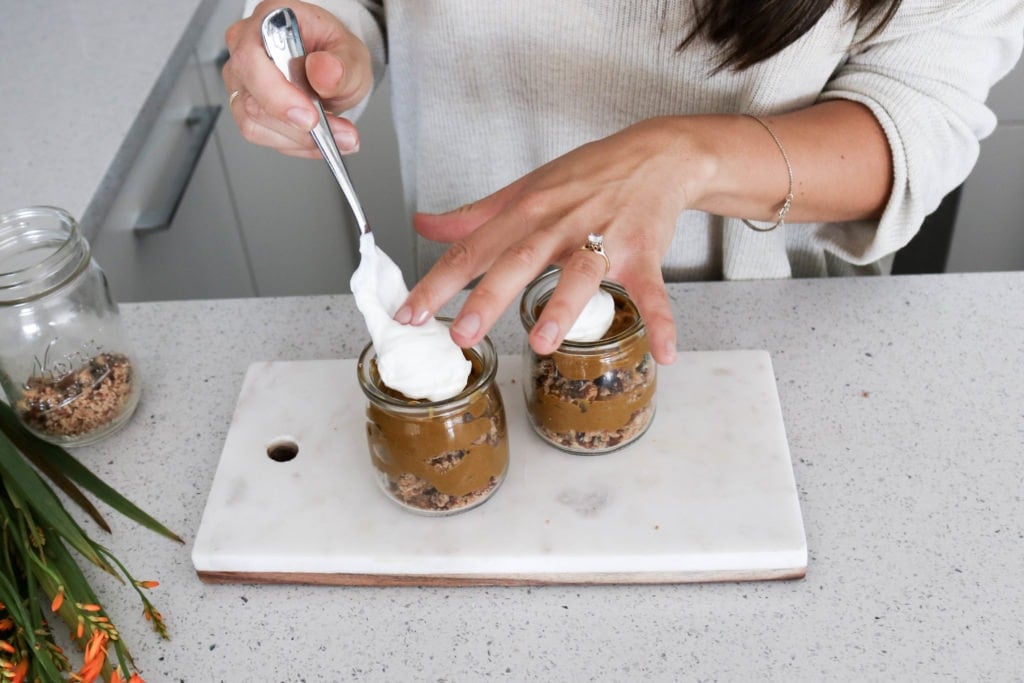 Dietitian Lindsay Pleskot Putting the Finishing touches on the deconstructed pumpkin pie with a dollop of creamy Greek yogurt