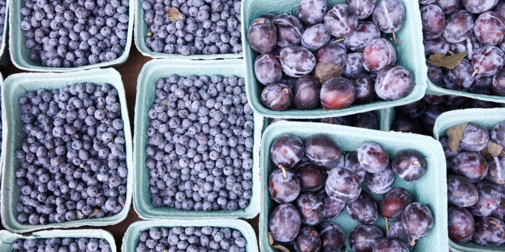 Market blueberries and plums.