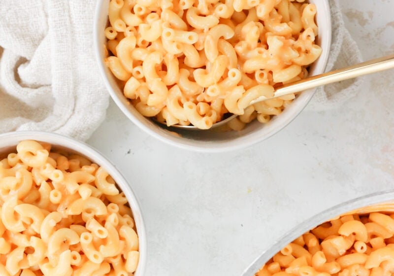 5 Ingredient Creamy Cottage Cheese Mac and Cheese in three white bowls on a white table