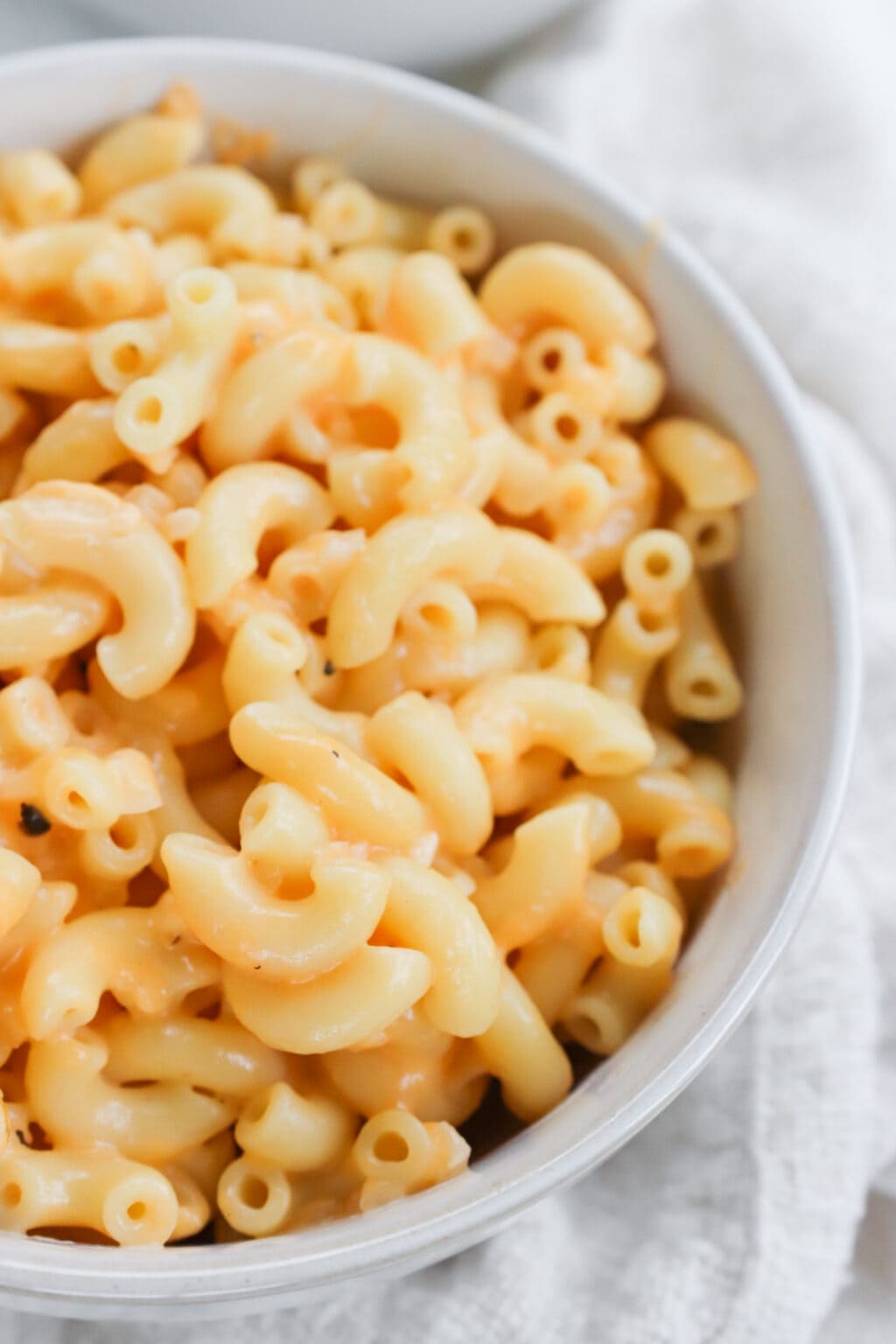 A close up shot of 5 Ingredient Creamy Cottage Cheese Mac and Cheese in a white bowl