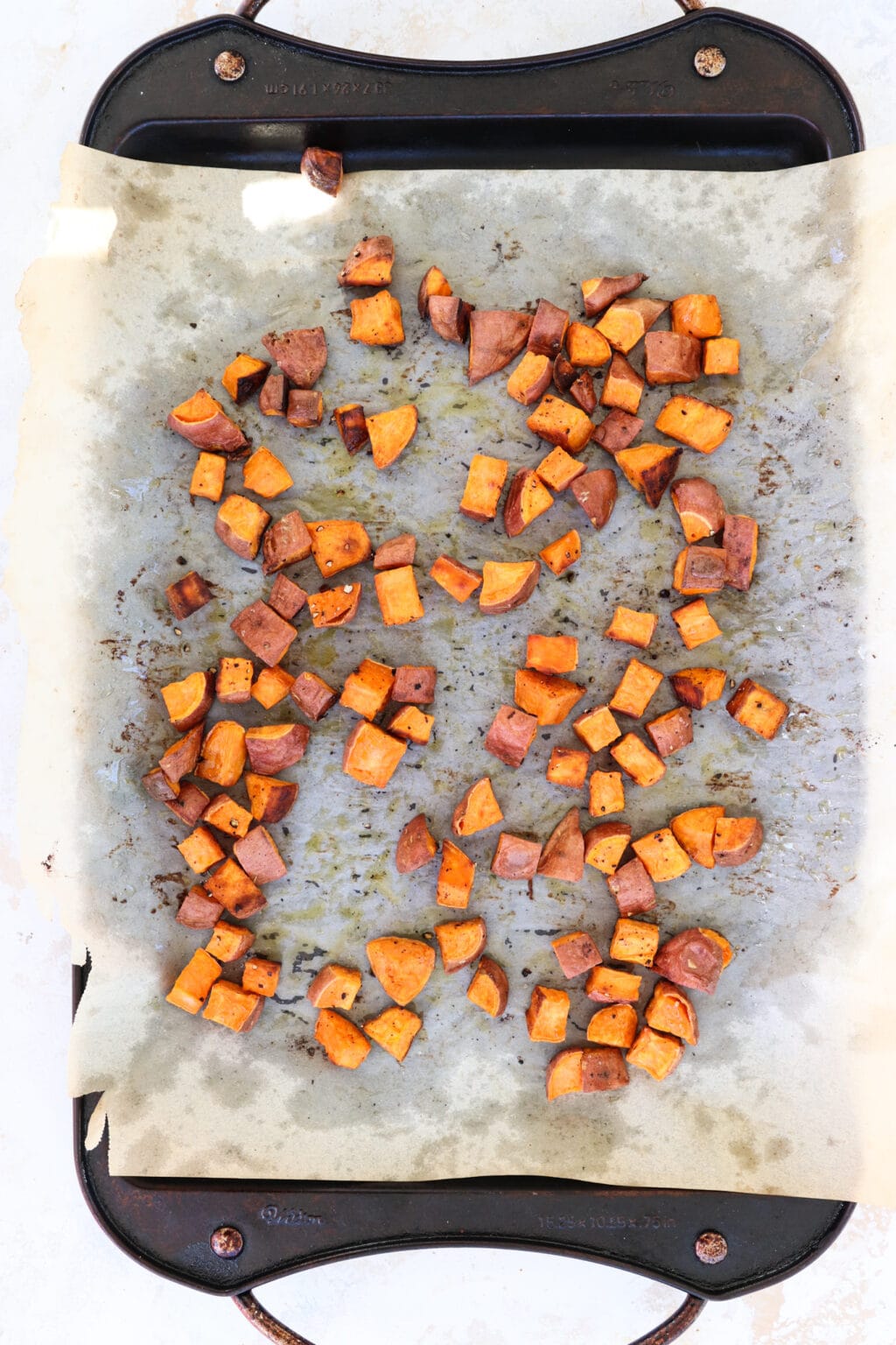 Roasted sweet potatoes on a baking sheet