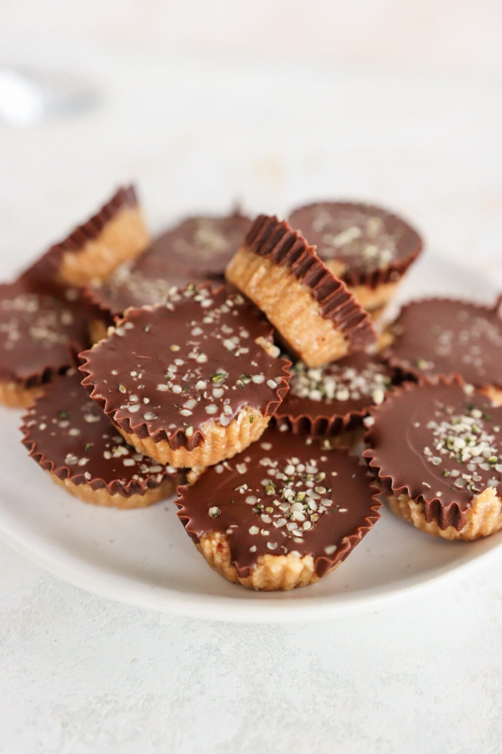 A white plate of No Bake Peanut Butter & Chocolate Protein Bars on a marble counter