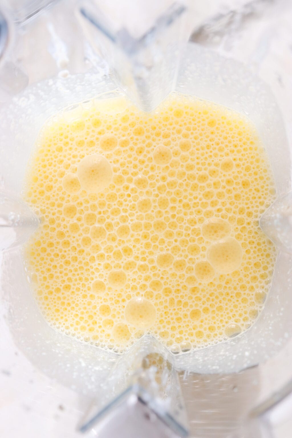 Eggs and cottage cheese blended in a blender for the Egg Bites with Cottage Cheese, Spinach & Sun-dried Tomatoes recipe