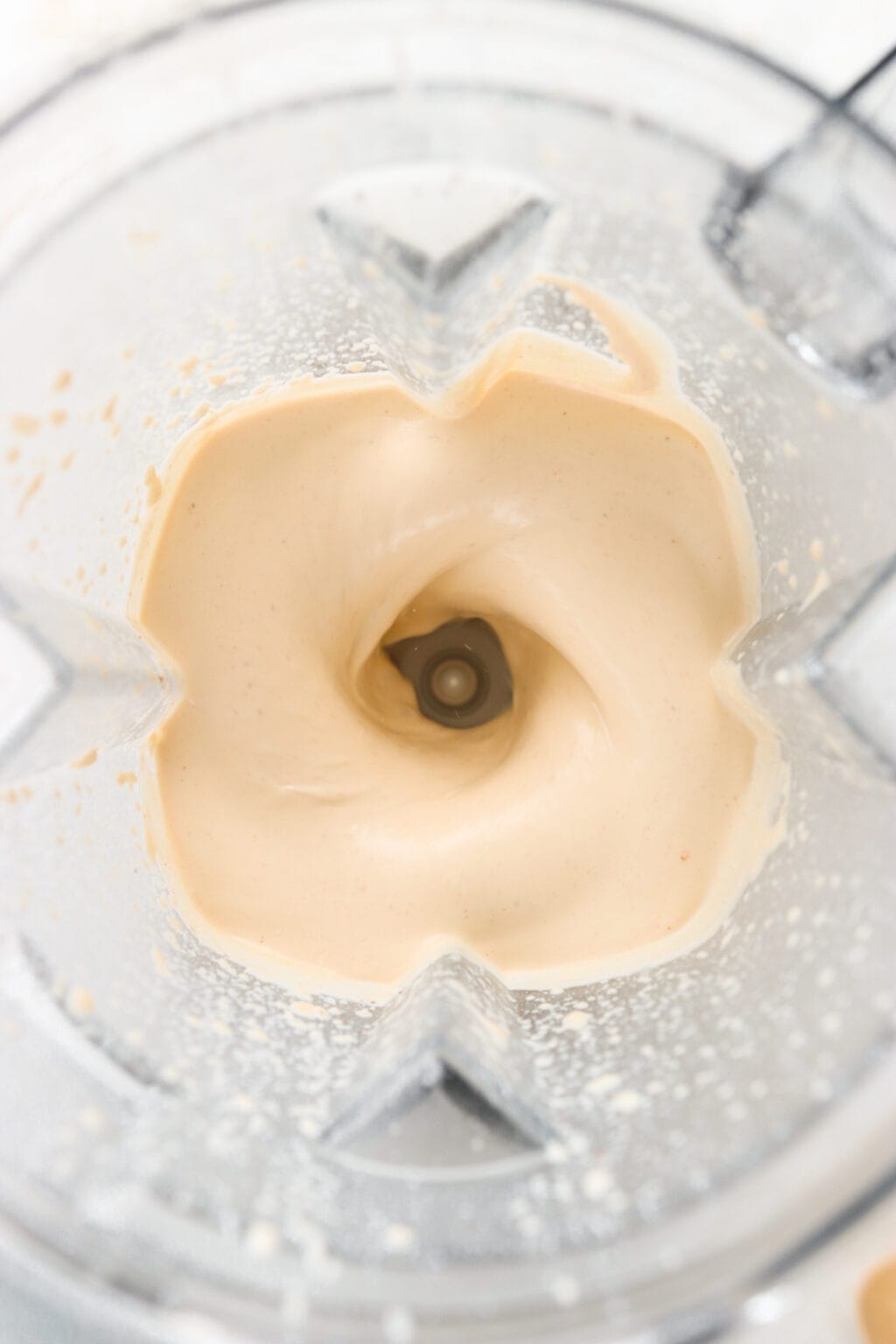 Ingredients for Quick Baked Cottage Cheese Pizza Bowl Dip blended in a blender, including cottage cheese, parmesan cheese, garlic powder, Italian seasoning, marinara sauce, mozzarella cheese, turkey pepperoni or pepperoni