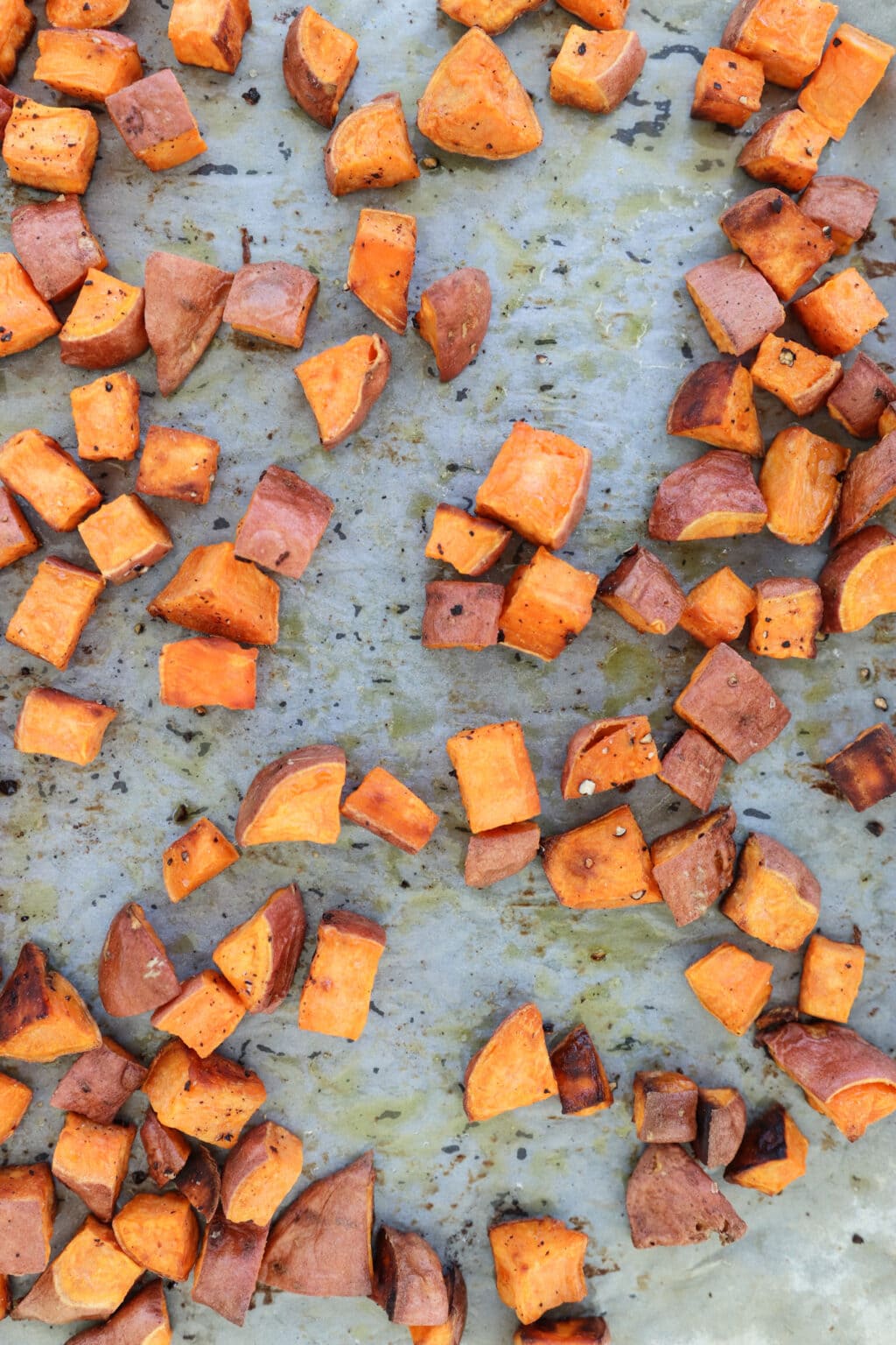 Meal prep roasted sweet potatoes cooked on a baking sheet