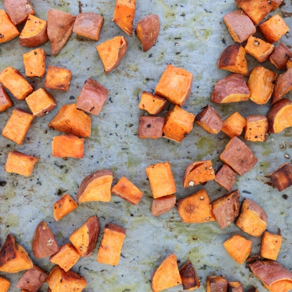 Meal prep roasted sweet potatoes cooked on a baking sheet