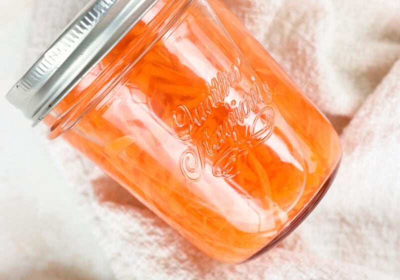 Quick pickled shredded carrots in a glass jar