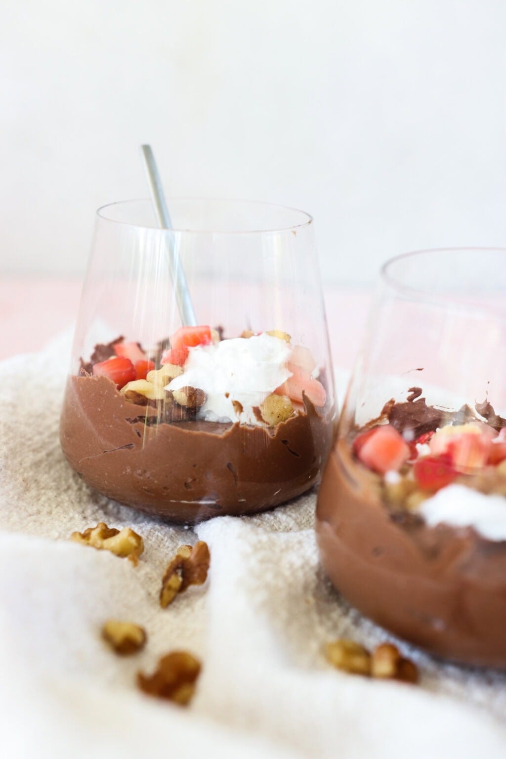 5-Minute Cottage Cheese Chocolate Mousse in two glass cups with strawberries and walnuts