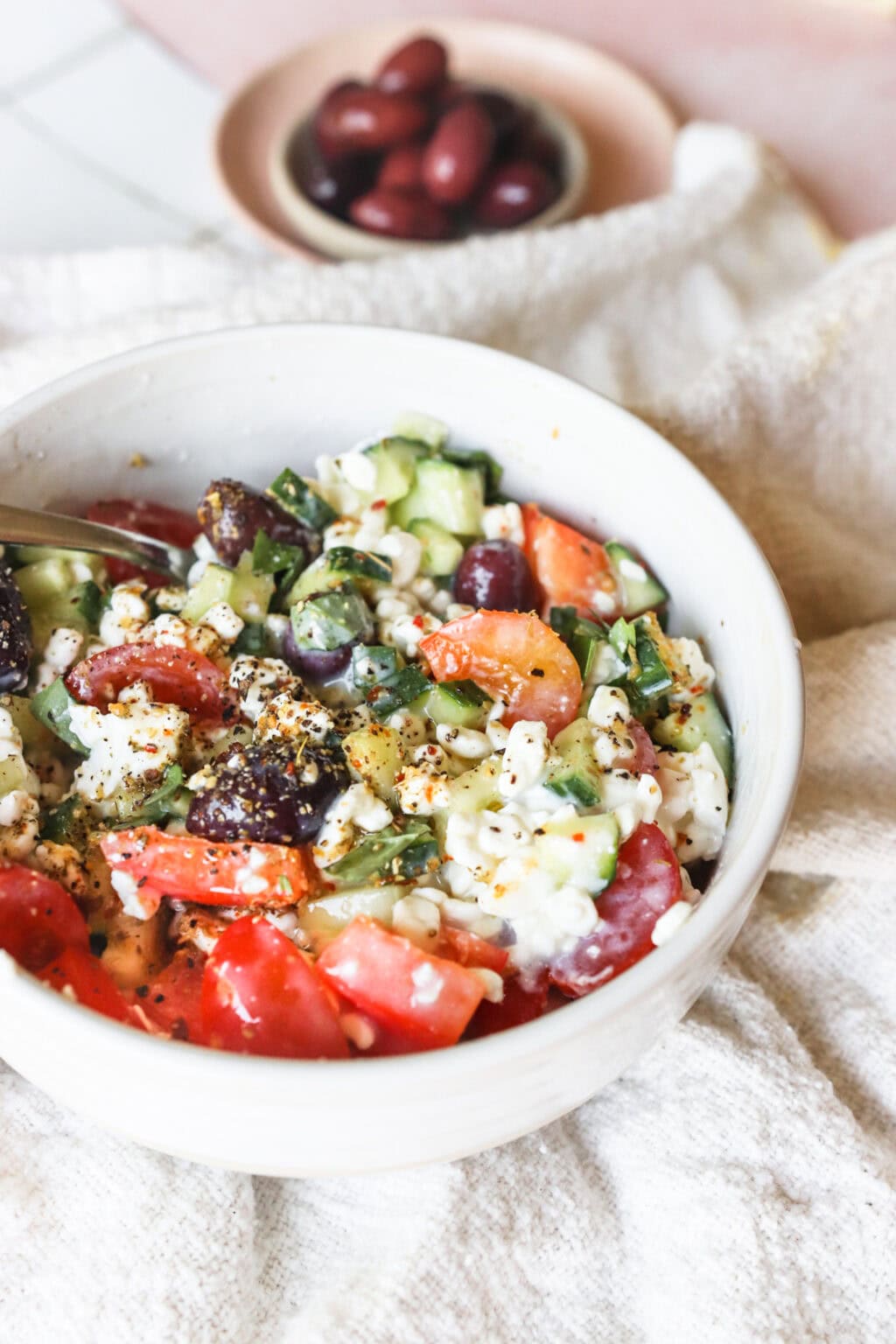 Easy Greek-Inspired Cottage Cheese Salad in a white bowl