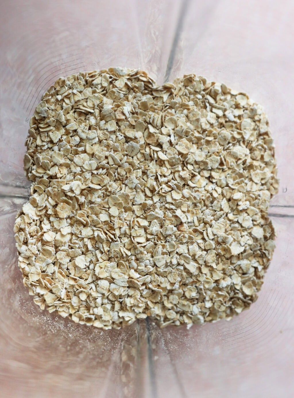 Unblended oats in a blender for Easy Oat Flour Pumpkin Bread with Chocolate Chips