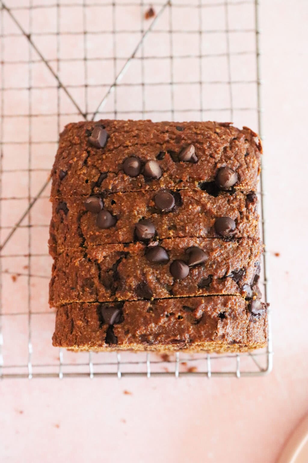 Sliced Easy Oat Flour Pumpkin Bread with Chocolate Chips on a wire rack