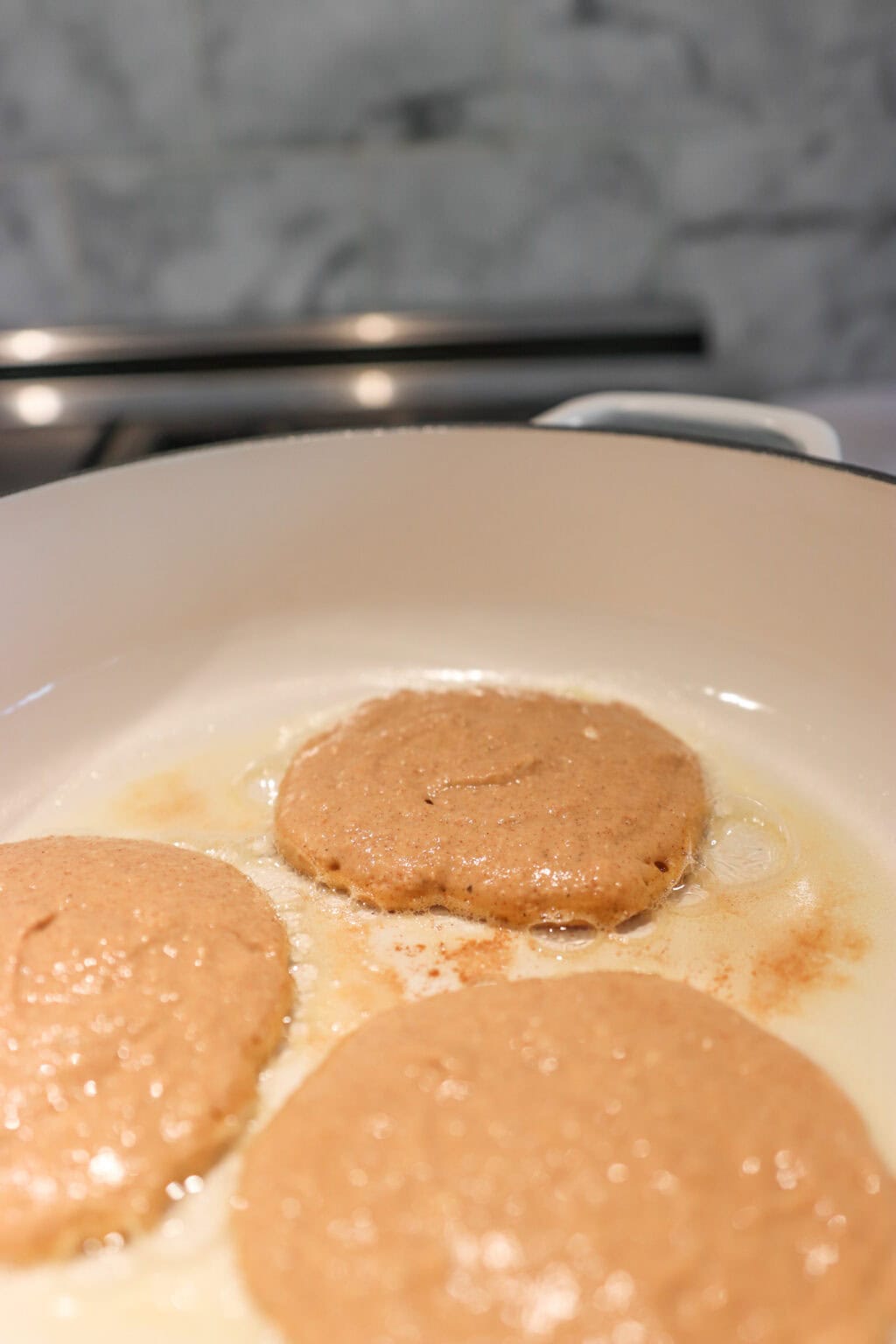Three High Protein Pumpkin Pancakes with Cottage Cheese in a white pan