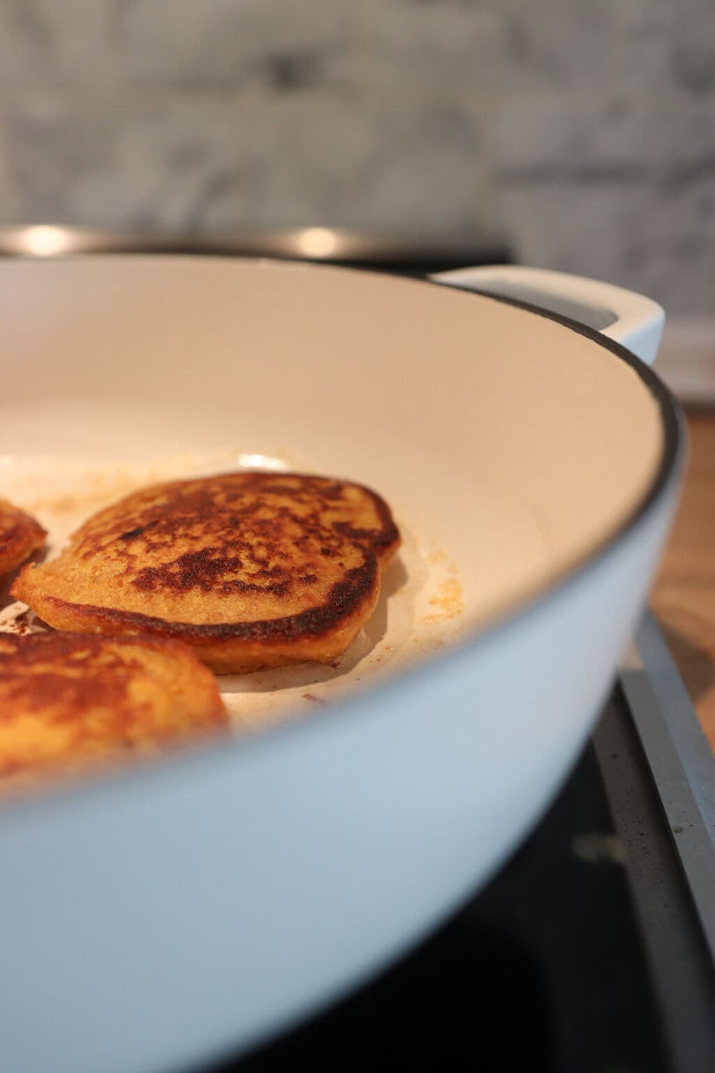 Three High Protein Pumpkin Pancakes with Cottage Cheese in a white pan