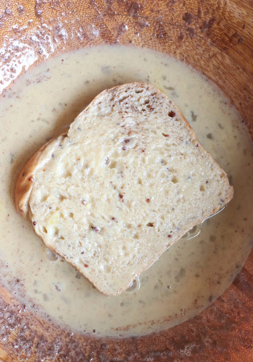 the bread dipped in egg before being brought to sheet pan