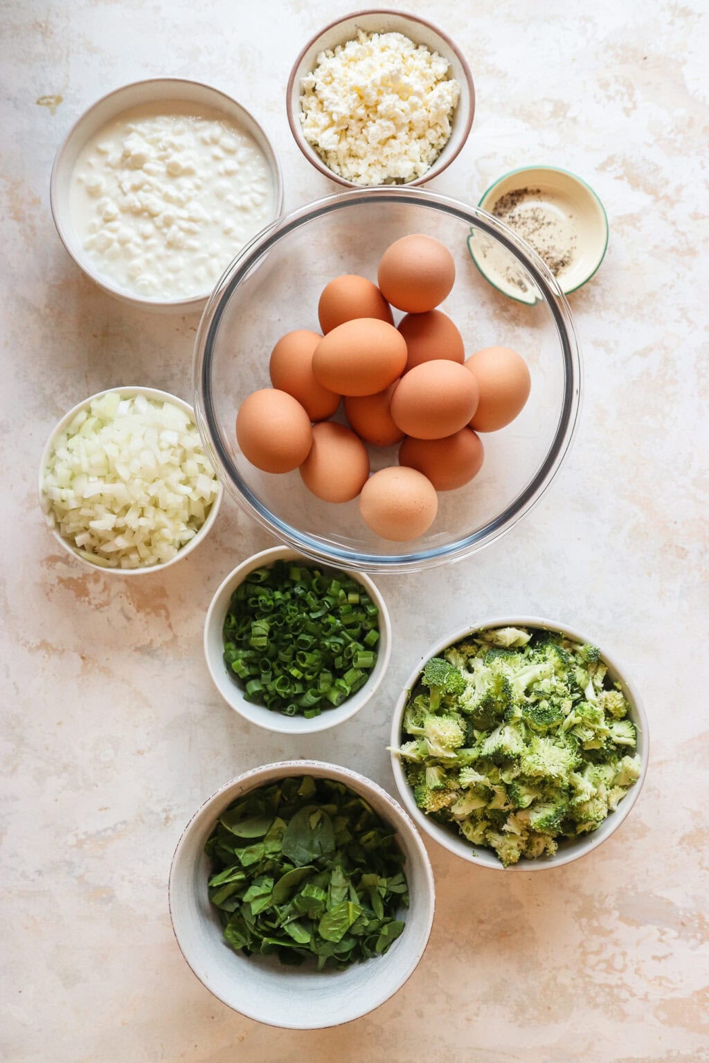 all the ingredients for Egg and Cottage Cheese Breakfast Bake in bowls separate