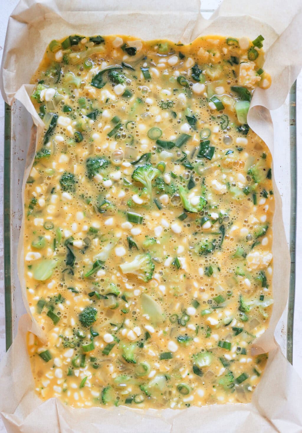 all the ingredients for the Egg and Cottage Cheese Breakfast Bake in a container ready to go into the oven