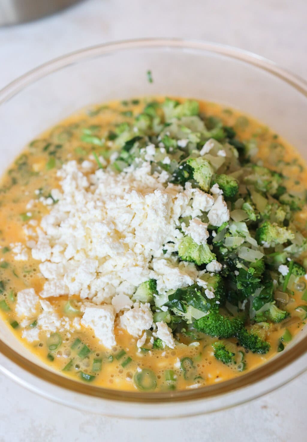 all ingredients for Egg and Cottage Cheese Breakfast Bake in a glass bowl before being mixed
