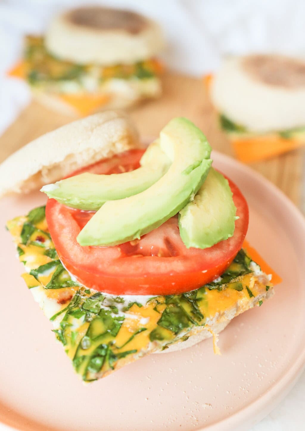 open sandwich of the egg bake breakfast sandwich, showing the avocado and tomato